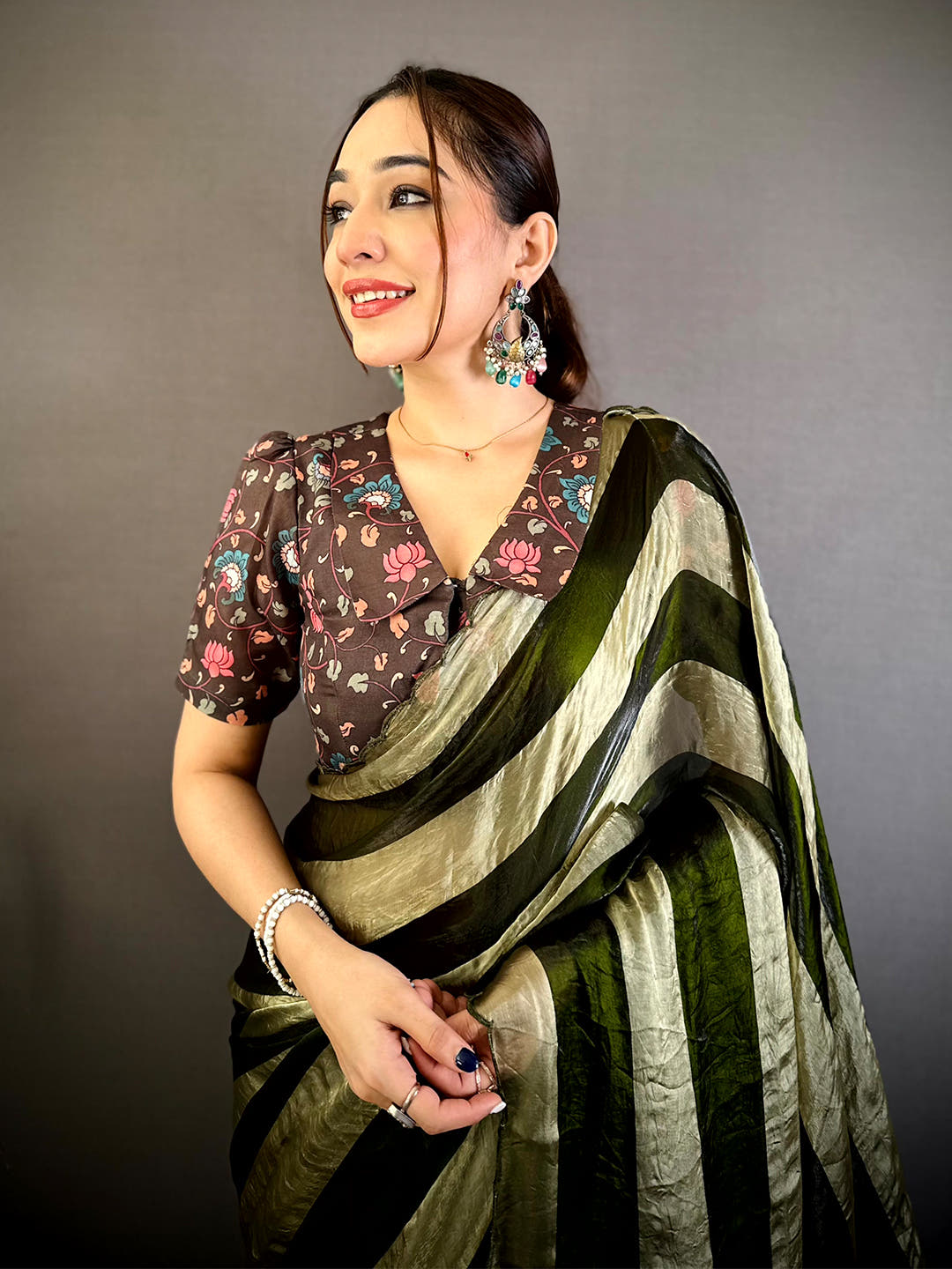 Opulent Shiny Silk Striped Print Saree