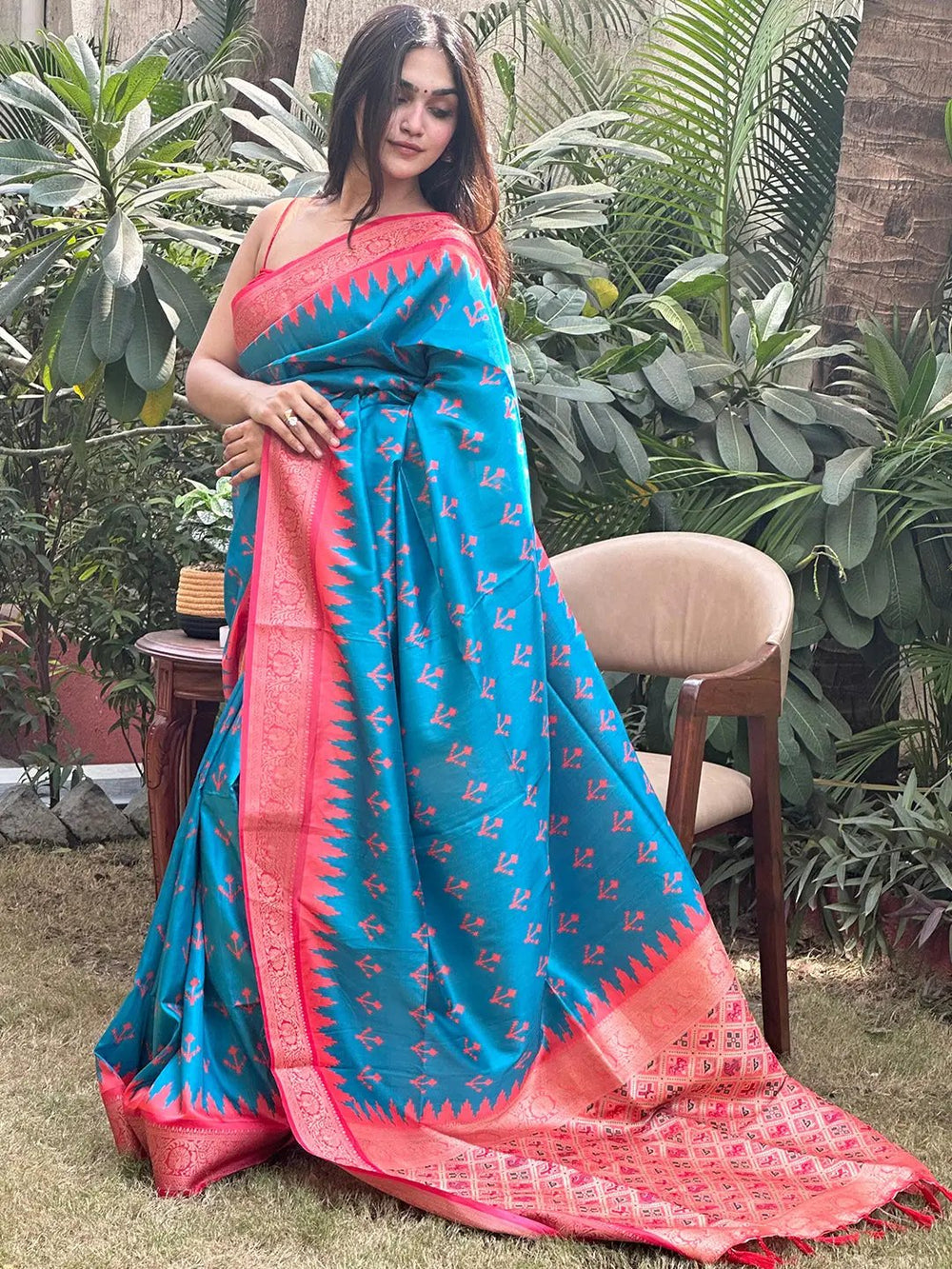 Chic blue Banarasi saree featuring red Patola pallu design