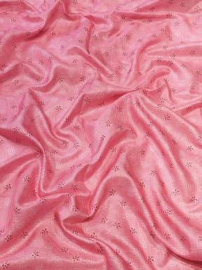 Pink fabric with delicate floral embroidery details