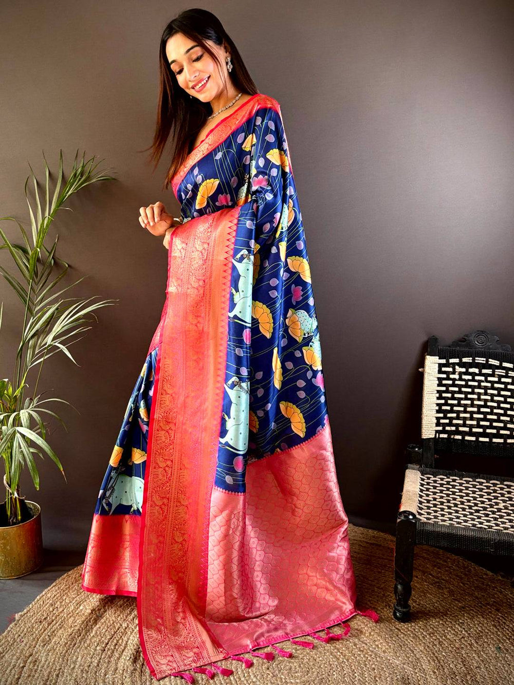 Stylish navy blue silk saree with Pichwai Kalamkari and pink border