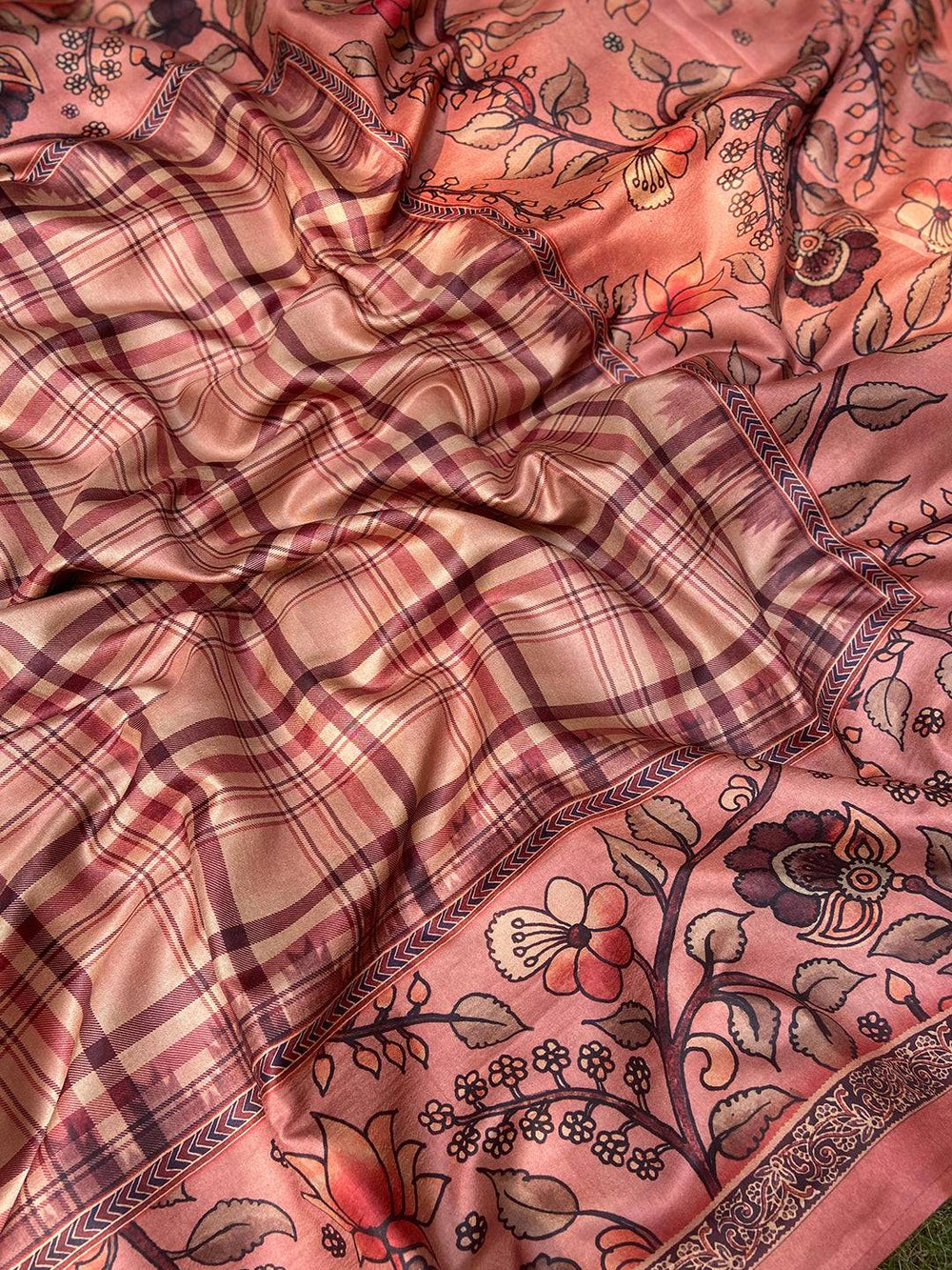 Close-up of floral kalamkari and chex motifs on saree