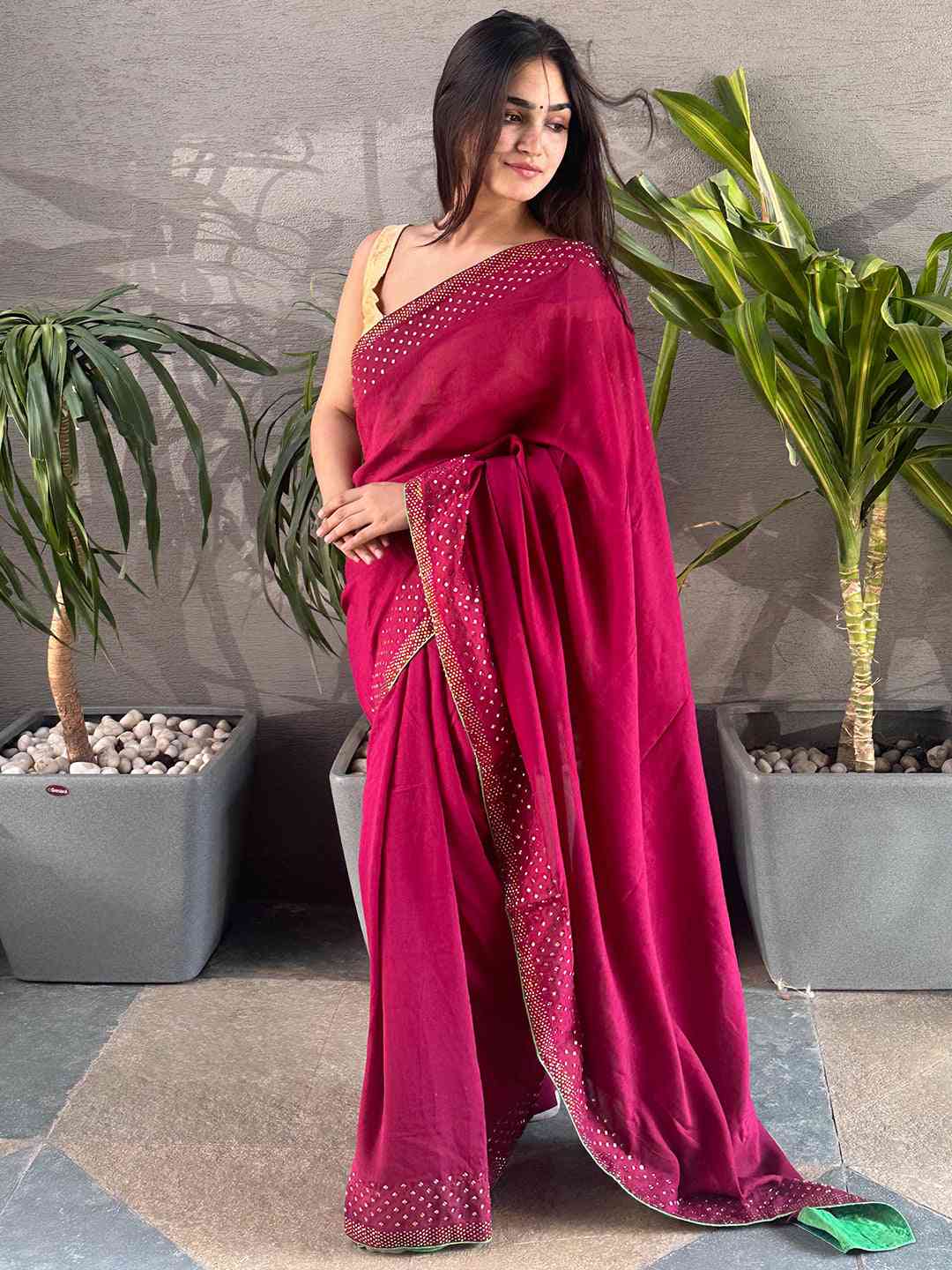 Wine Vichitra Silk Saree with Swarovski stones, model posing