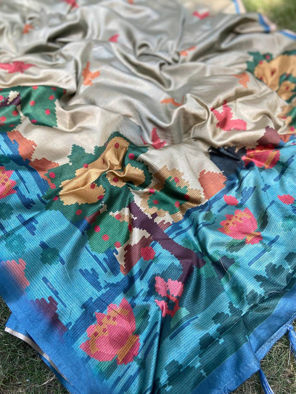 Teal Kalamkari saree with vibrant Ikkat print details