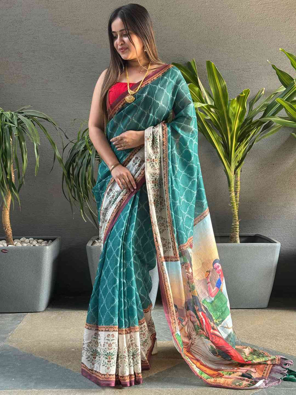 Teal Ikkat saree with kalamkari design, front view