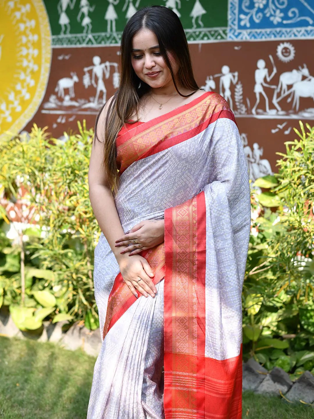 Soft silk Bandhej saree featuring a vibrant red border
