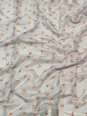 Close-up of blue saree fabric with floral and zari chex pattern.