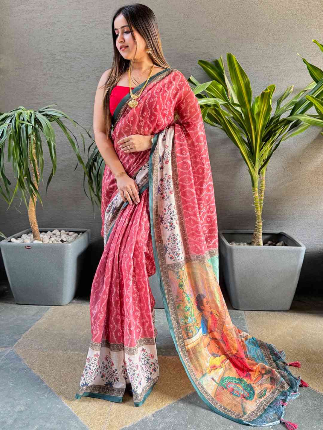 Gajari Ikkat saree with Kalamkari design, model displaying saree