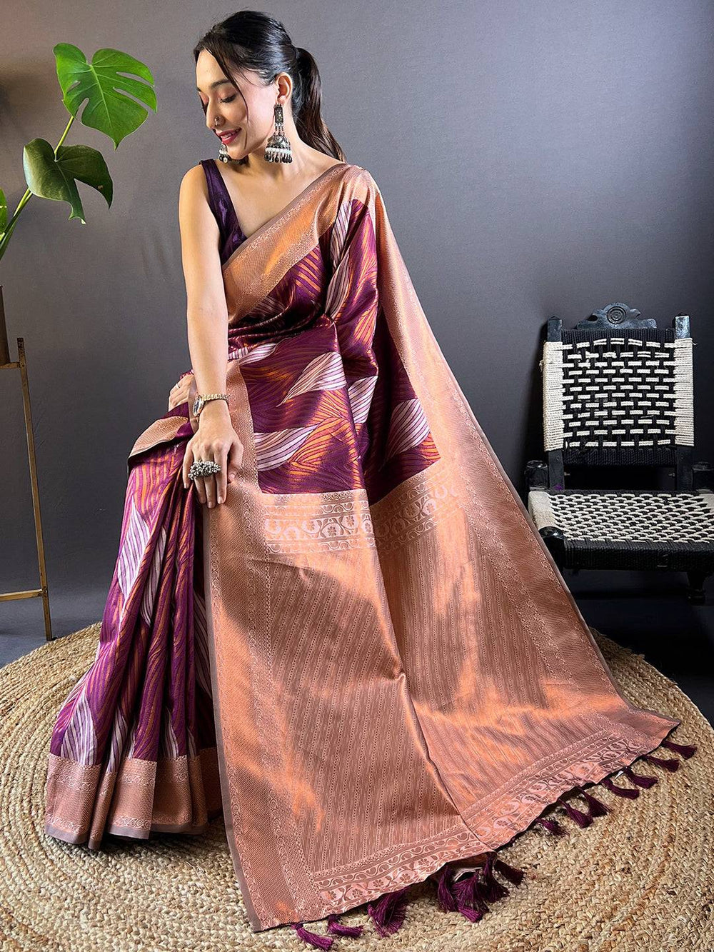 Model Seated in Cherry Tussar Silk Ikkat Saree
