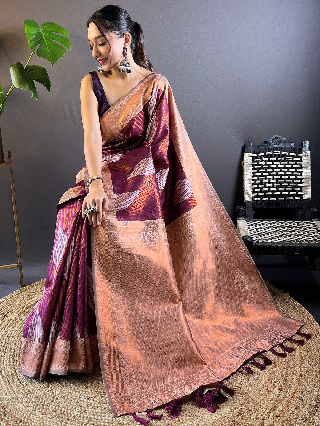 Model Seated in Cherry Tussar Silk Ikkat Saree