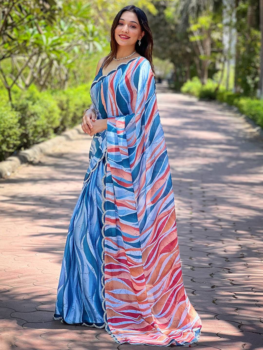 Elegant blue batik and polka dots print saree on woman