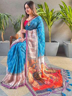 Blue geometric print saree with kalamkari design, seated model