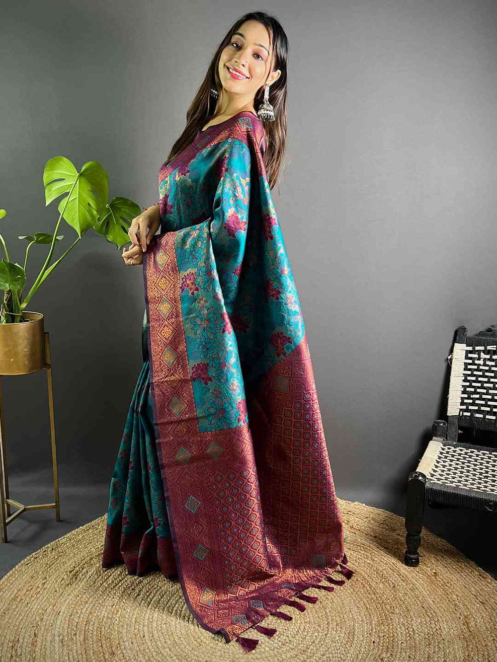 Model showcasing Teal Soft Silk Butta Weaving Saree with tassels