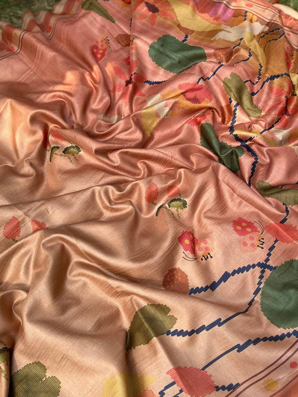 Close-up of Brown Tussar Silk Saree with vibrant Kalamkari design