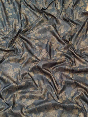 Dark fabric with subtle floral patterns