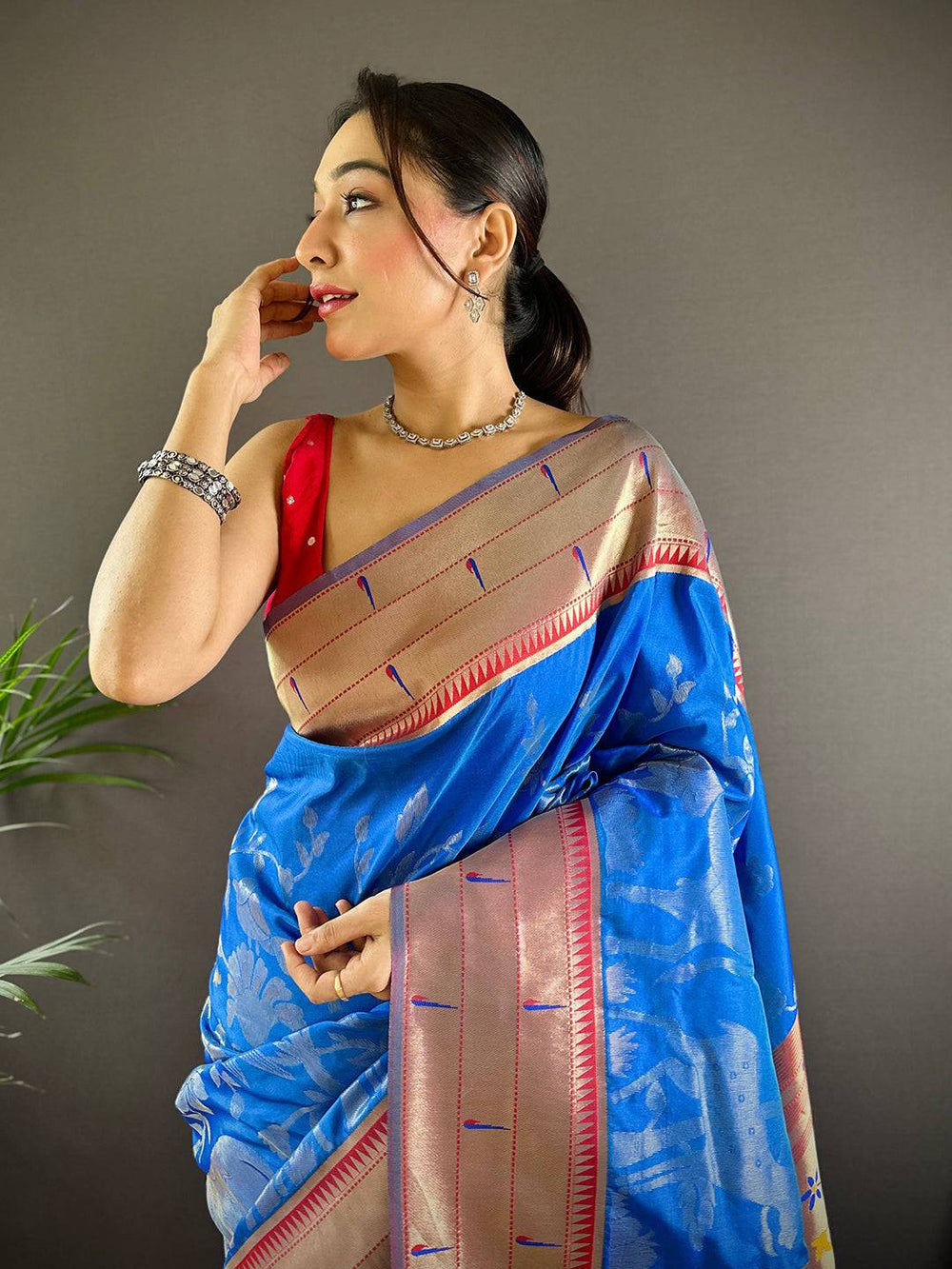 Royal Blue Paithani Silk Saree with Pichwai design, worn by model.