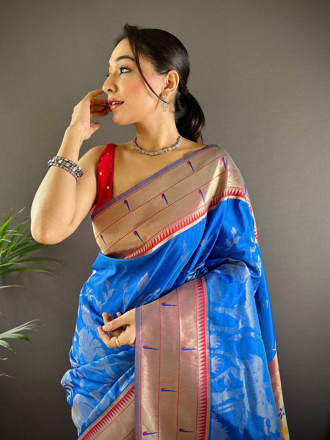 Royal Blue Paithani Silk Saree with Pichwai design, worn by model.
