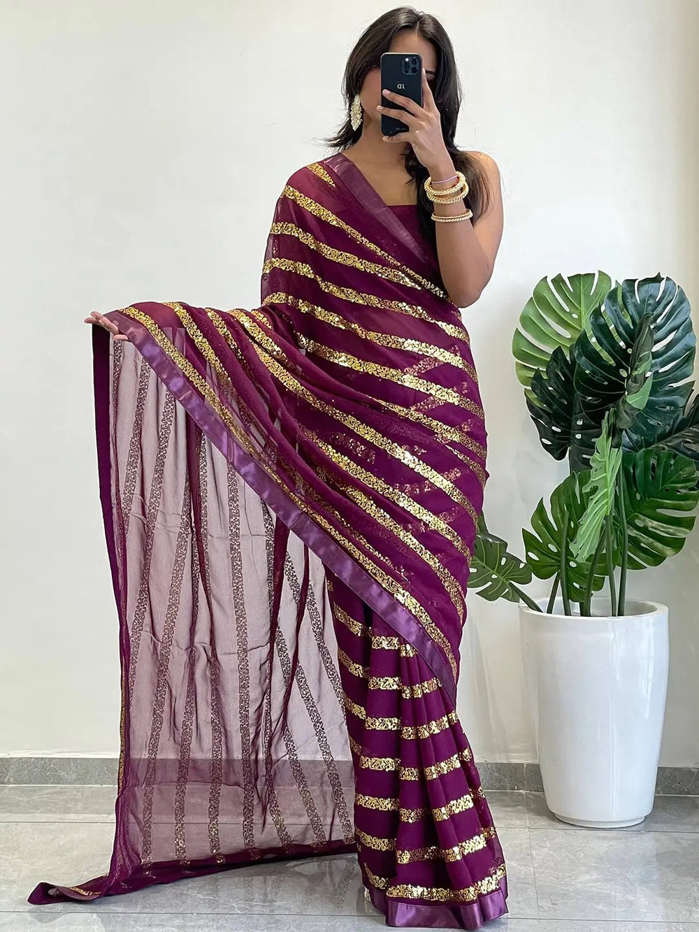 Georgette saree with striped sequins work and solid border