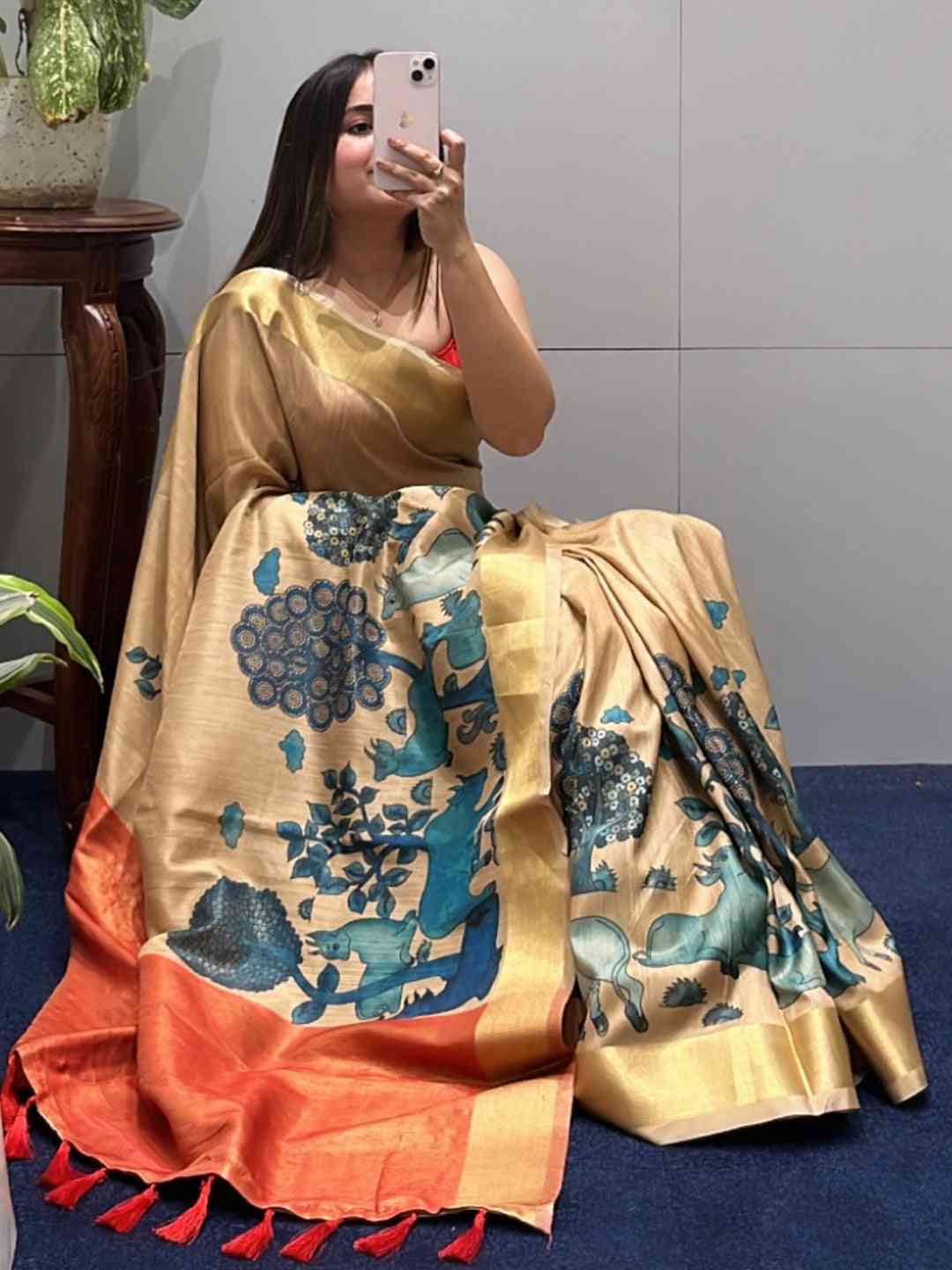 Elegant Kalamkari linen tissue saree with intricate designs.