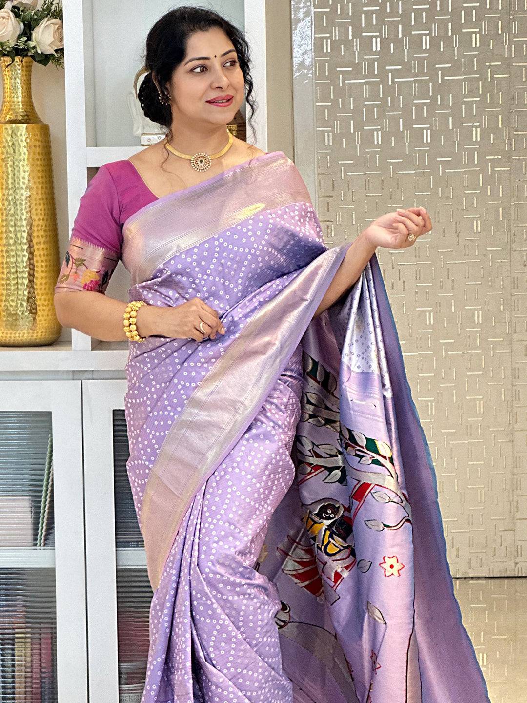Lavender soft silk Bandhej saree with intricate weaving design.
