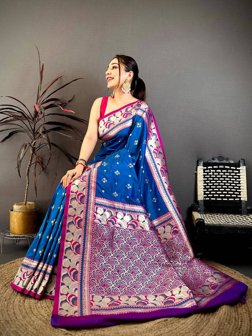 Royal Blue Soft Silk Kanjivaram Saree displayed on grass with detailed border