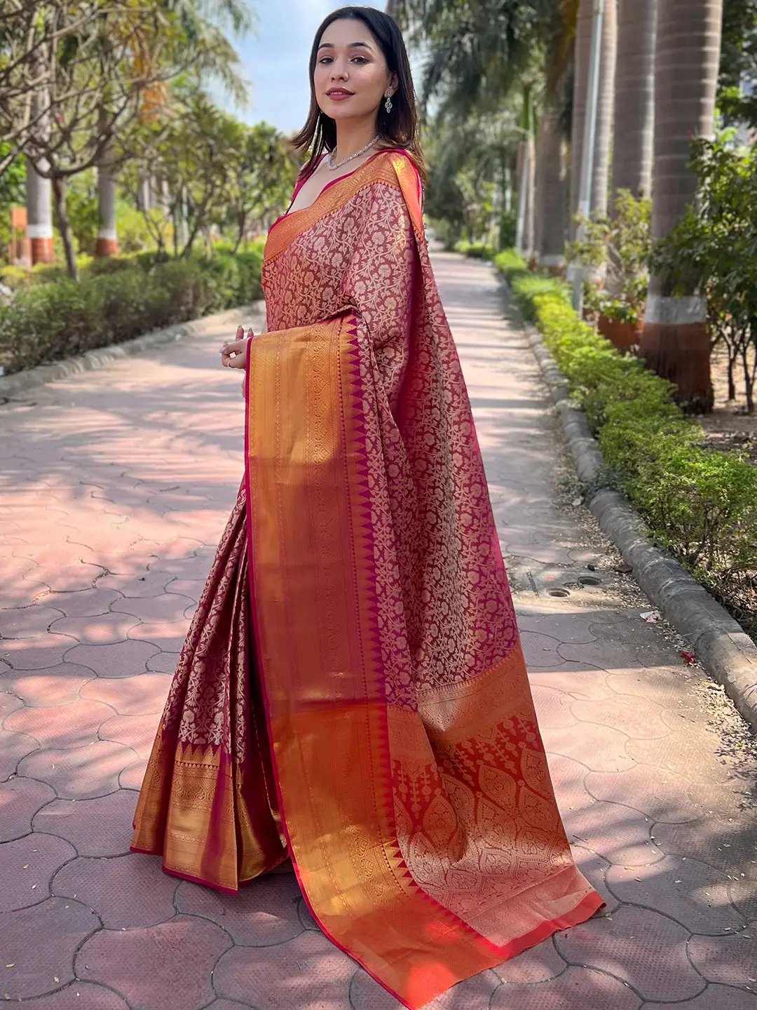 Side view of pink gold tissue saree with jacquard design