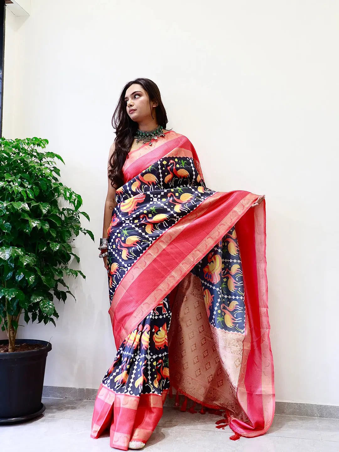 Elegant soft silk saree with vibrant Pochampally print and Gadwal border.