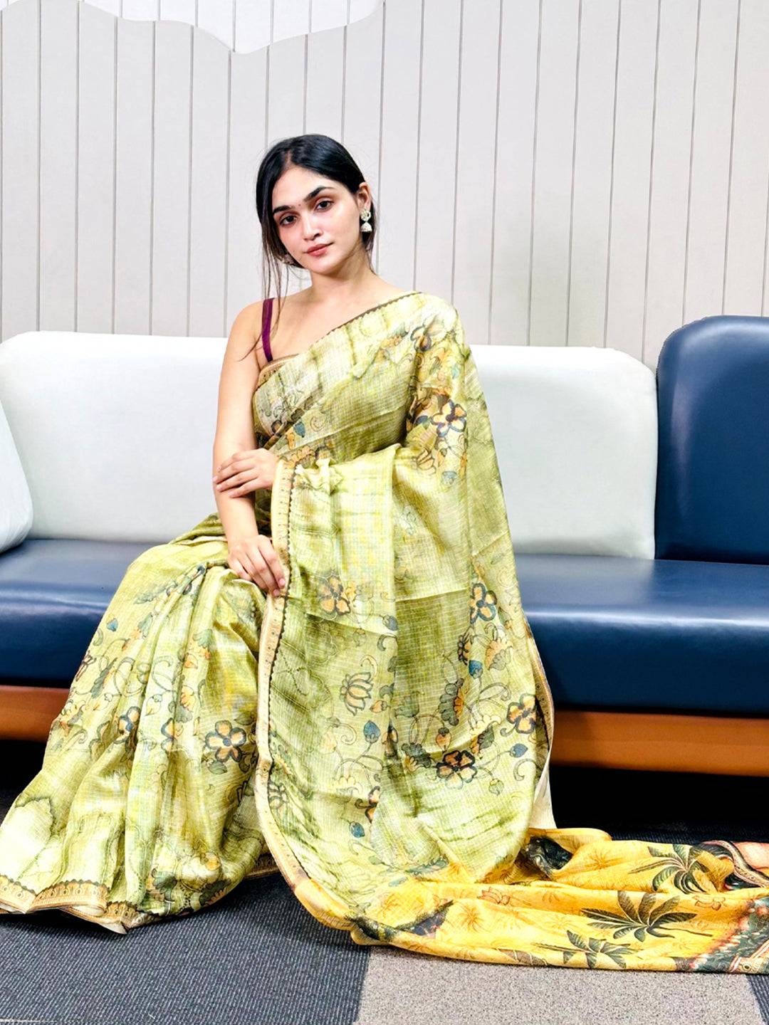 Light green Kota Doriya silk saree with floral print draped elegantly