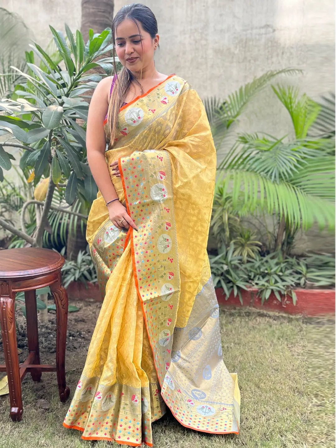 Traditional yellow Kota Doria silk saree with floral patterns