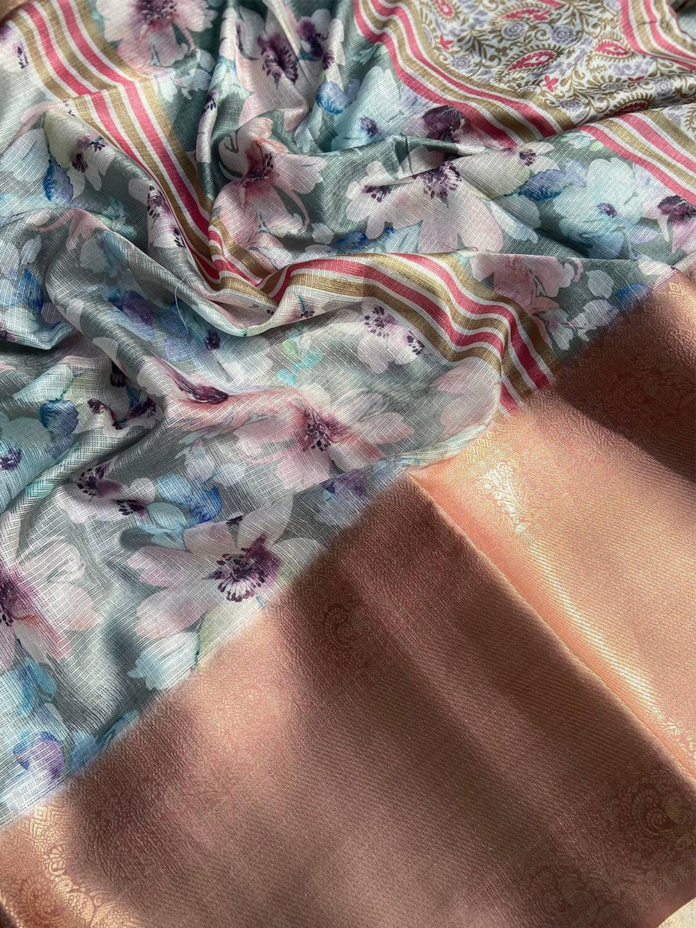 Detailed view of floral Pista Kota Doriya saree with gold border
