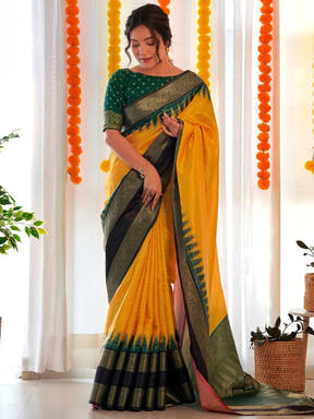 Elegant yellow Banarasi Gadwal saree with black and green border.