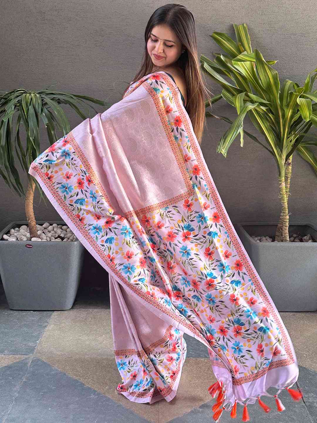 Light pink Kanjivaram saree with floral print, side view