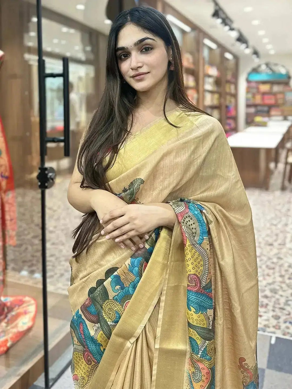 Close-up of Pen Kalamkari Linen Tissue Soft Saree with vibrant patterns.