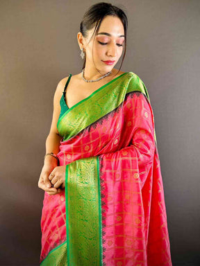 Model wearing blush pink Kovai Banarasi silk saree with green border
