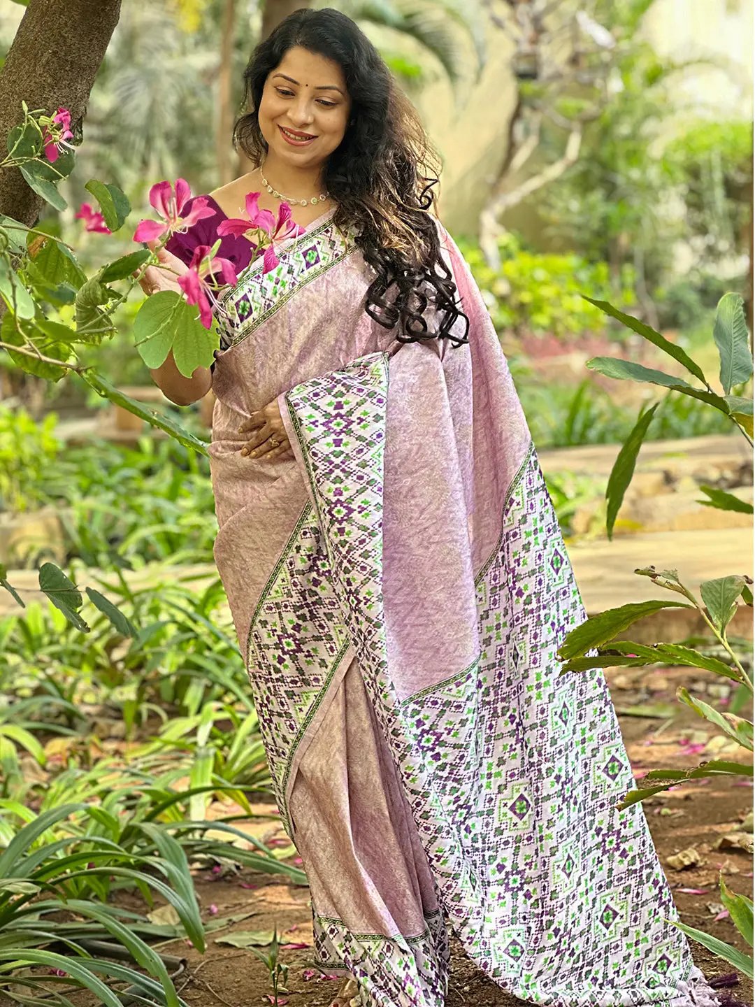 Elegant pink Kanjivaram saree with Patola print in garden