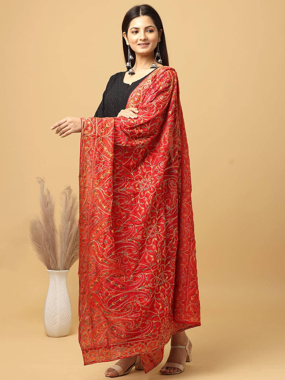 Side view of red pashmina threadwork dupatta on model