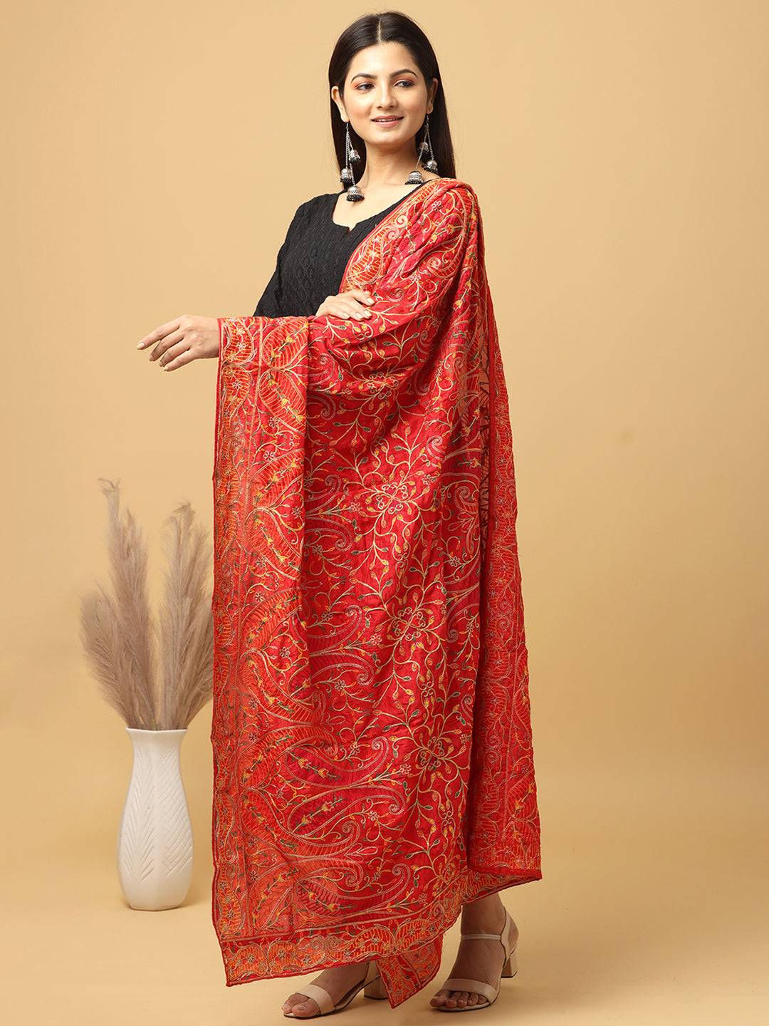 Side view of red pashmina threadwork dupatta on model