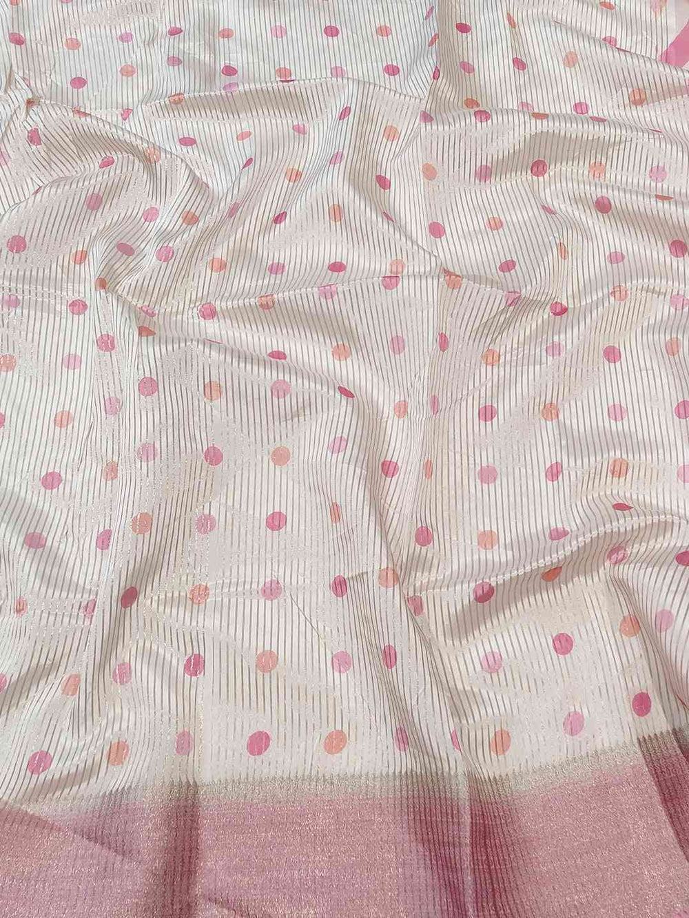 Polka dot pattern on soft organza saree fabric