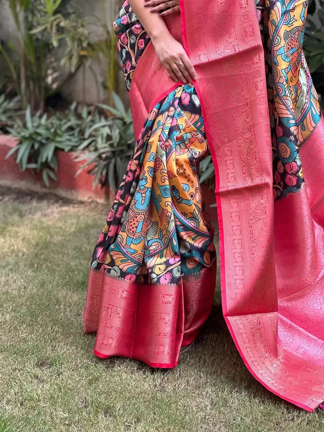 Close-up of Kalamkari digital print on soft silk saree