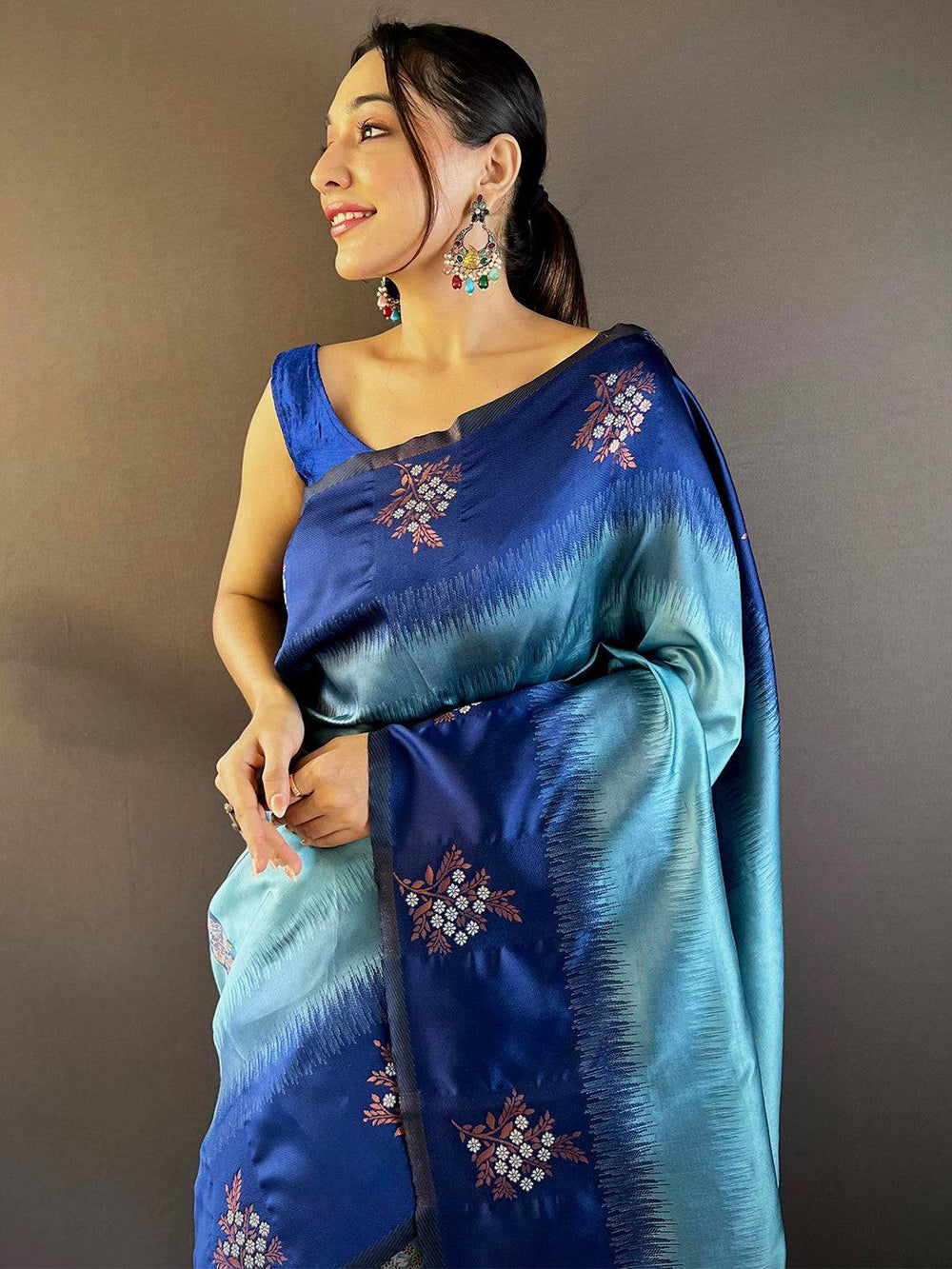 Model in sky blue Sami Banarasi Tussar silk saree, side view