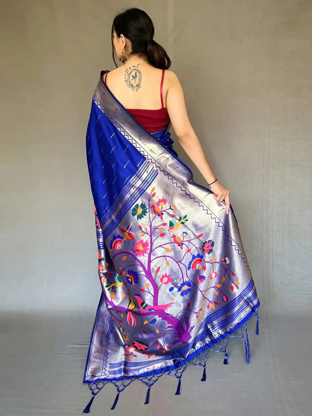 Back view of royal blue Paithani saree with floral pallu