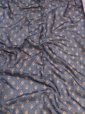 Close-up of fabric pattern on purple linen saree