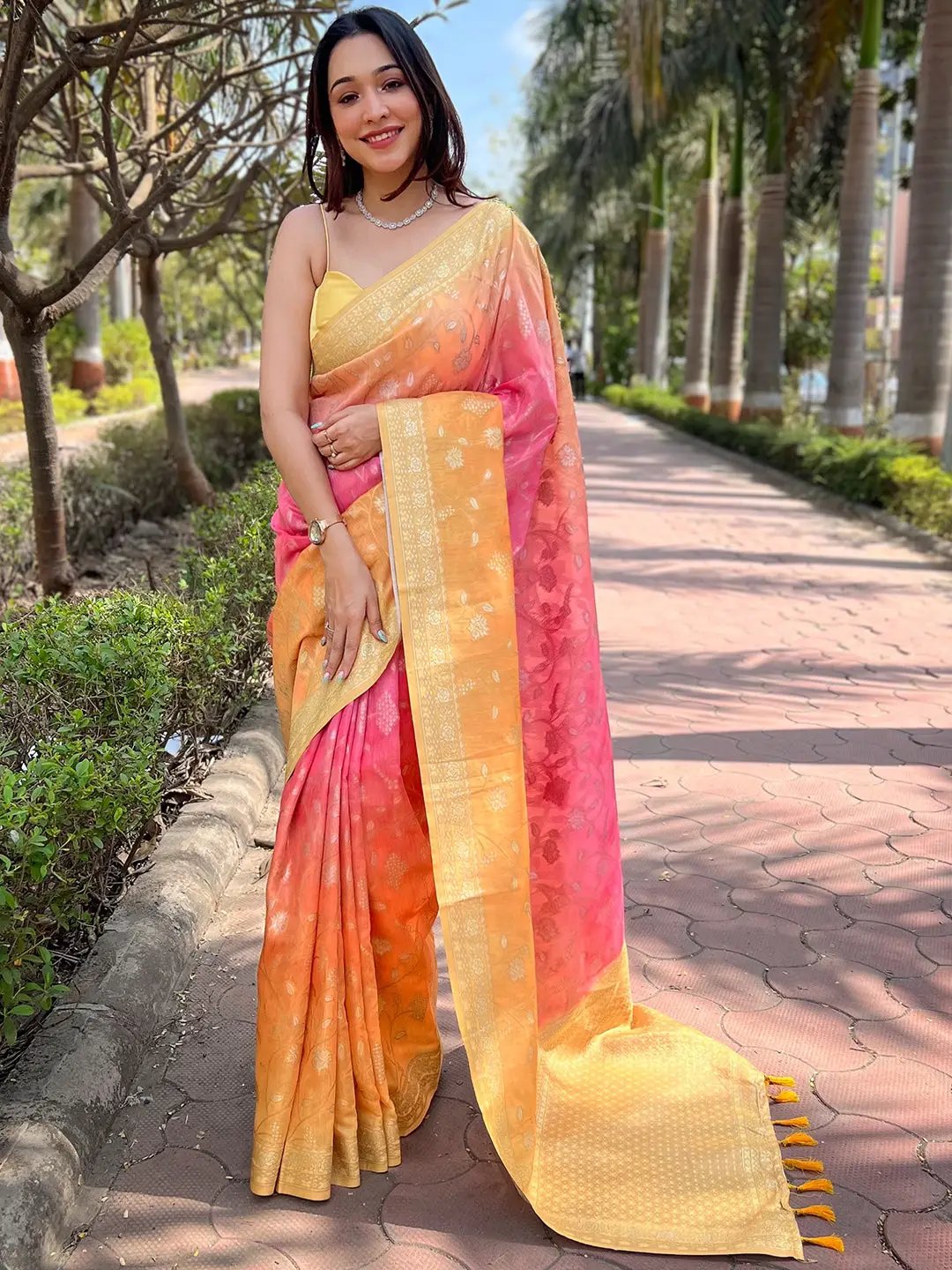 Model in pink Bollywood soft slub silk saree with zari weaving