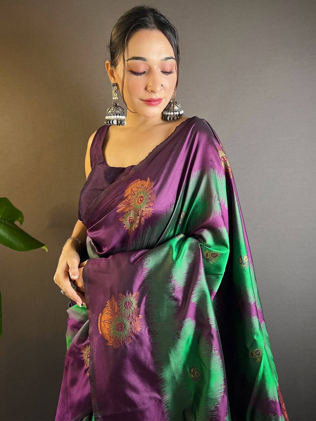 Model wearing dark green tussar silk Ikkat weaving saree.