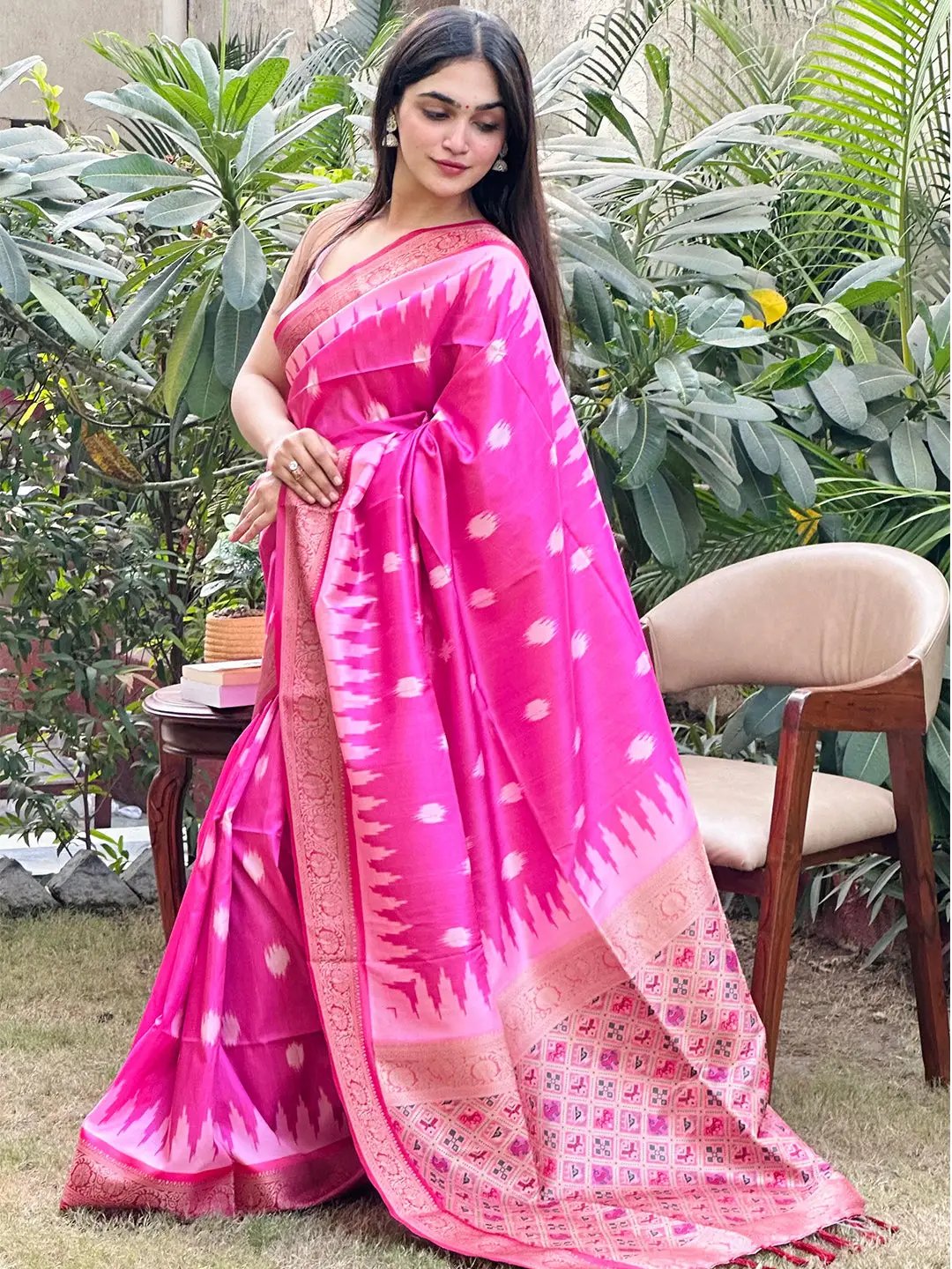 Traditional pink Banarasi saree with detailed zari patola pallu