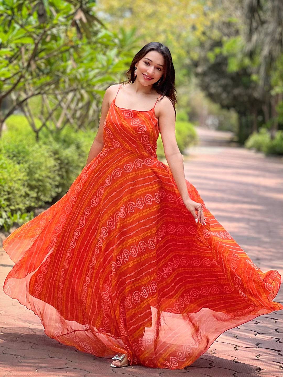Flowing Portland Orange Bandhej Print Dress in garden