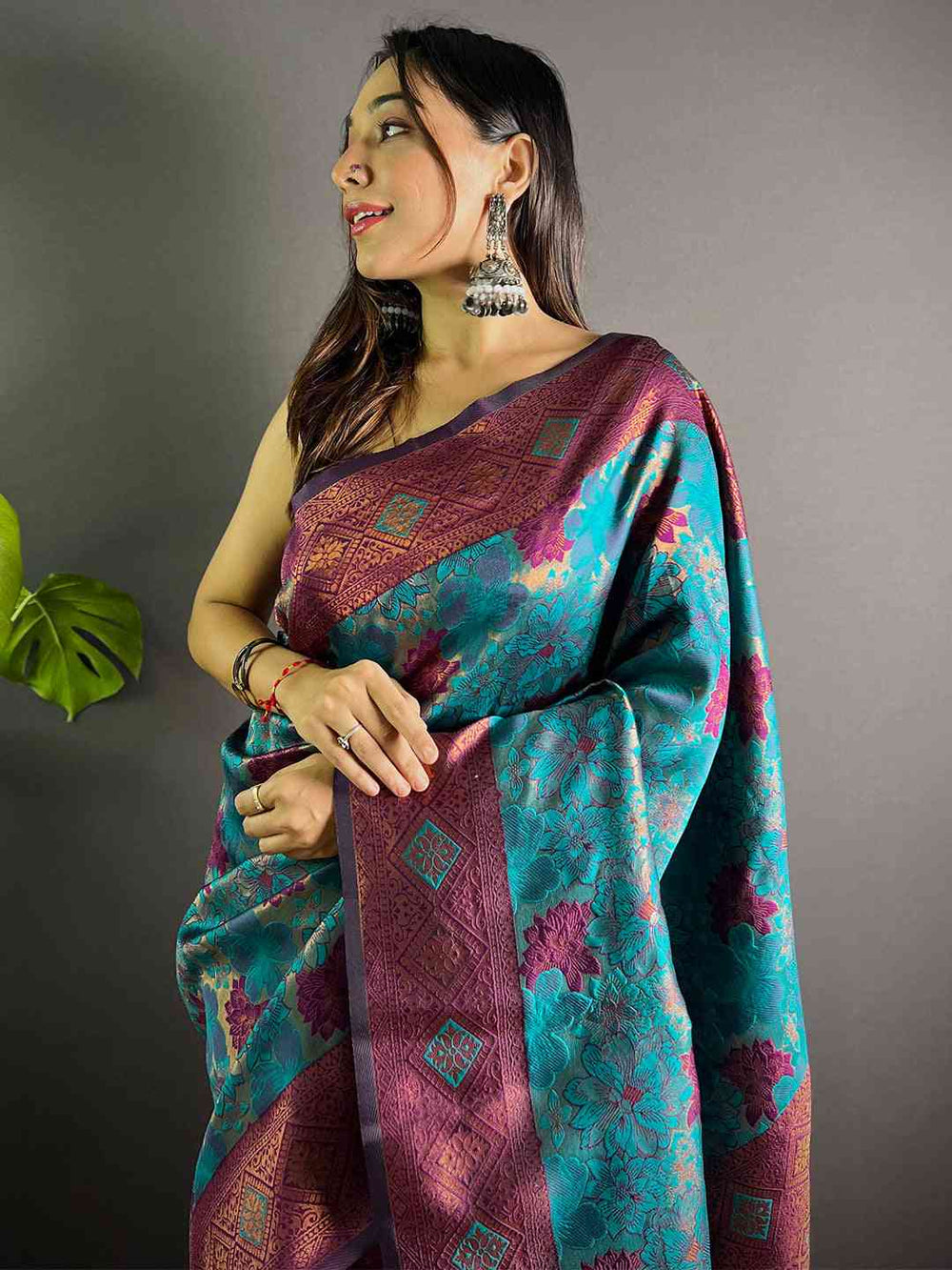Teal Soft Silk Butta Weaving Saree draped elegantly
