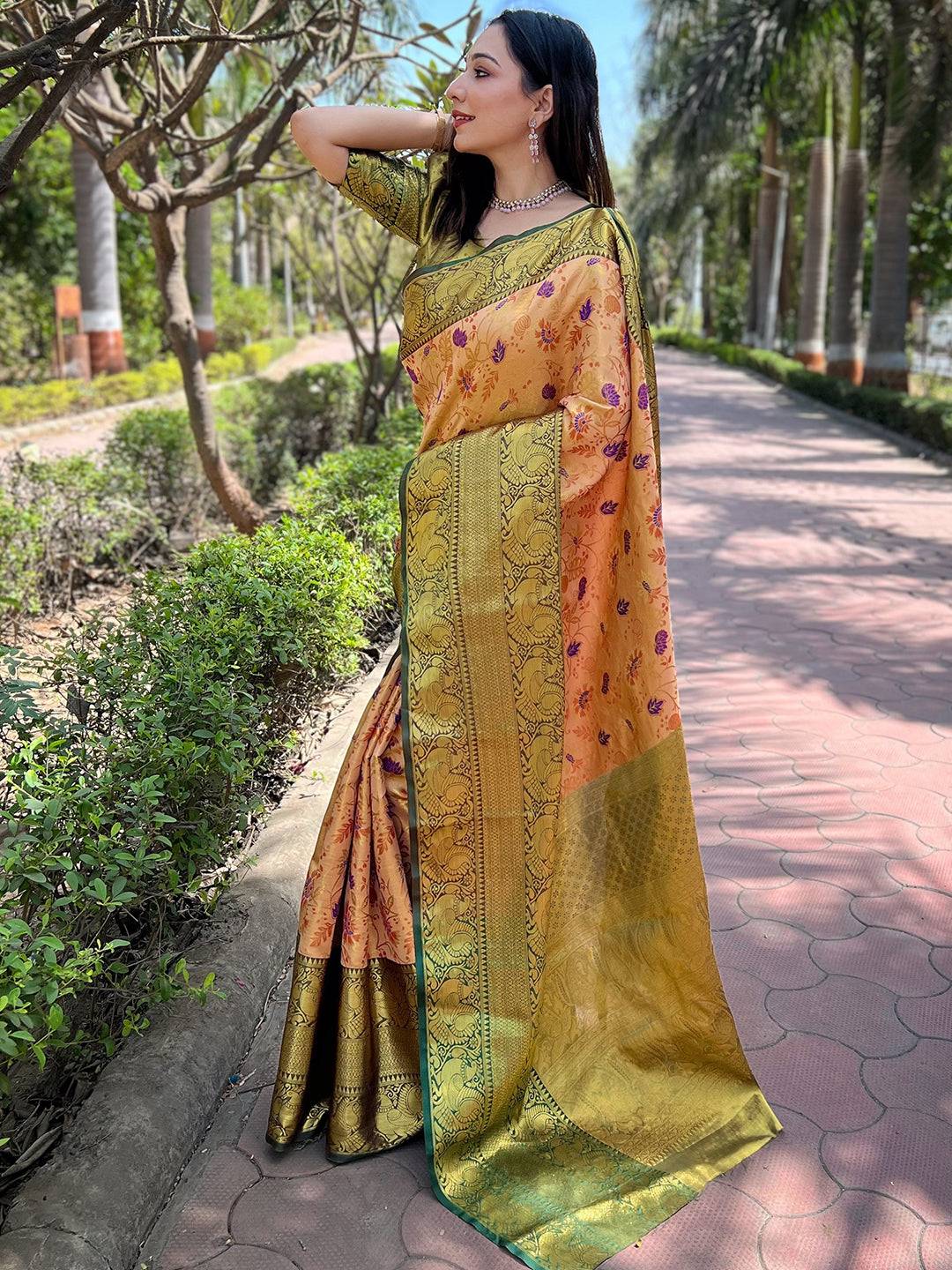 Traditional orange Banarasi saree with rich gold patterns