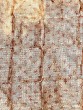 Backside of orange Kota Doriya silk saree with subtle floral pattern.