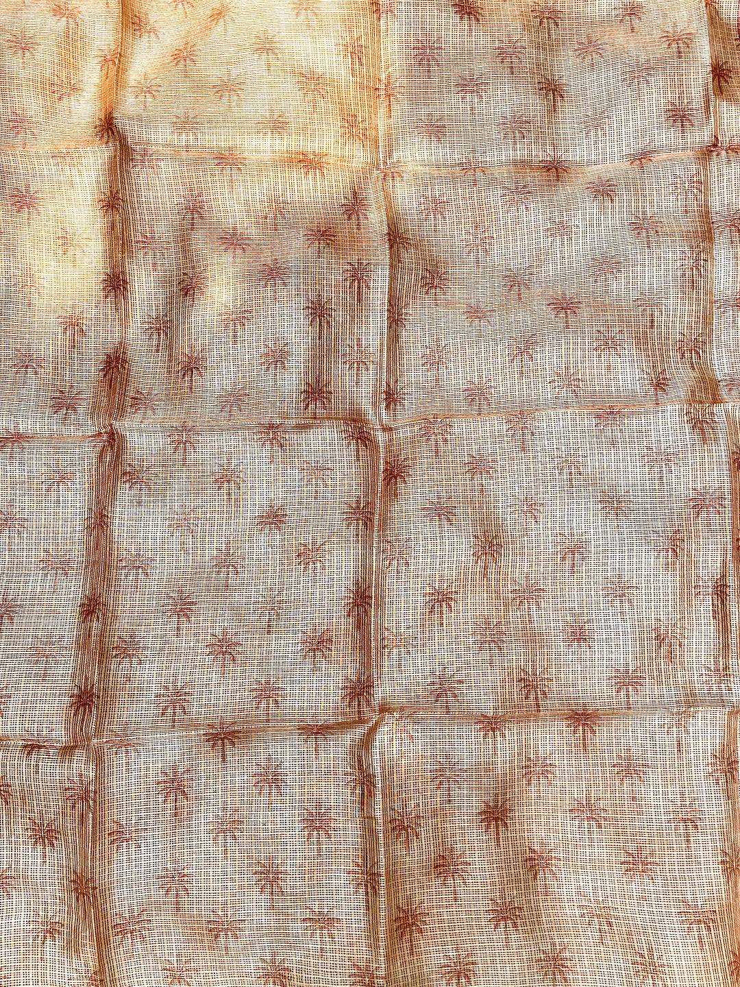 Backside of orange Kota Doriya silk saree with subtle floral pattern.