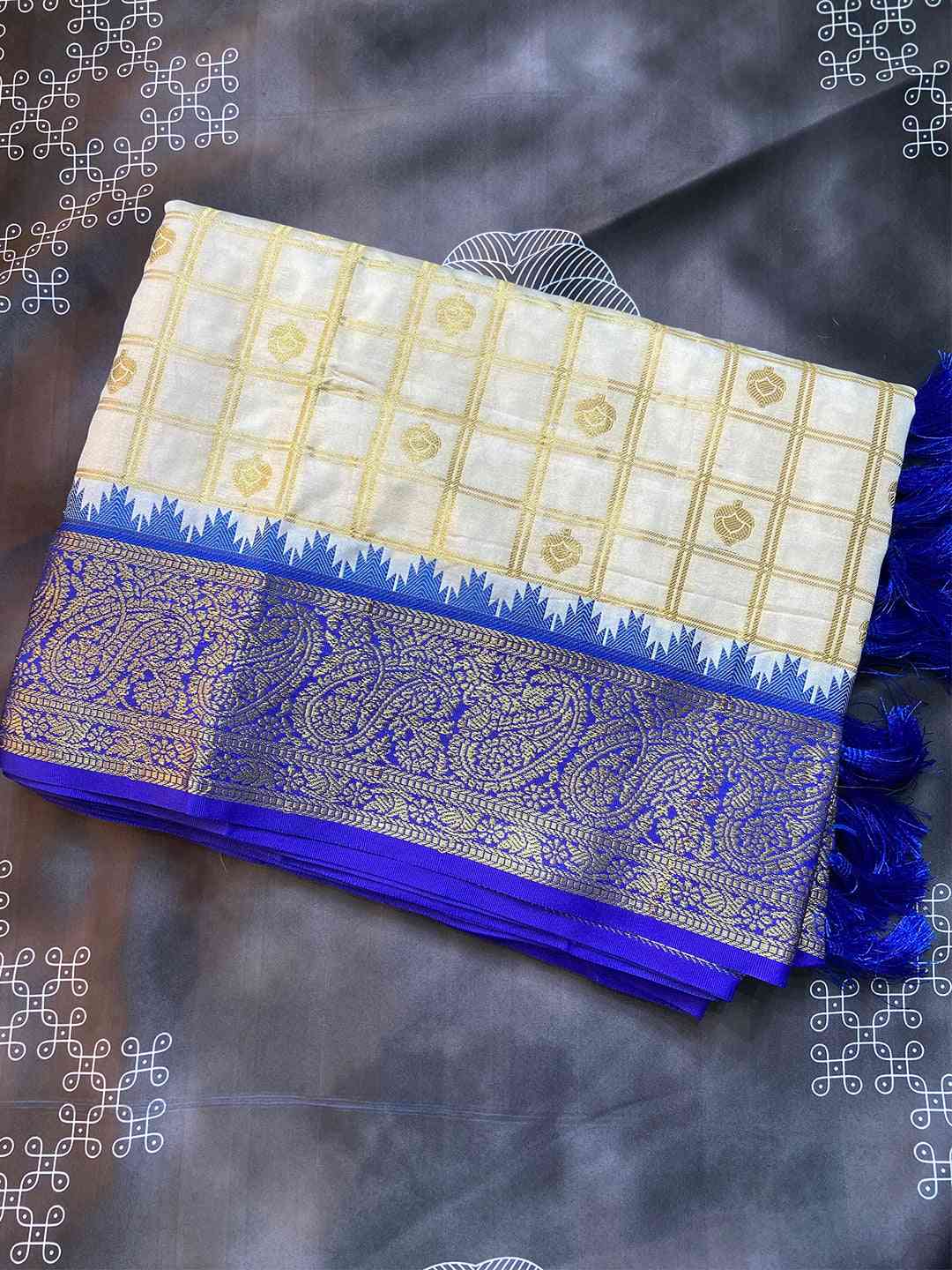 Folded soft silk Gadwal saree with temple border